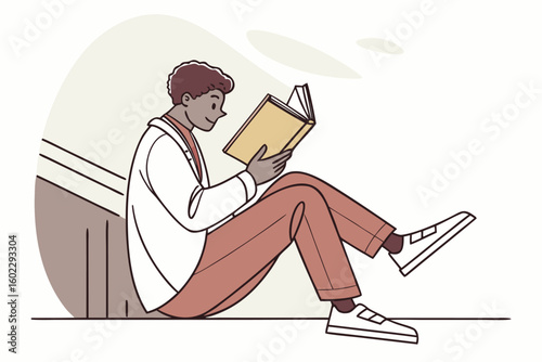 Reading in a cozy spot while sitting on the stairs in a modern interior setting, enjoying a quiet moment with a book