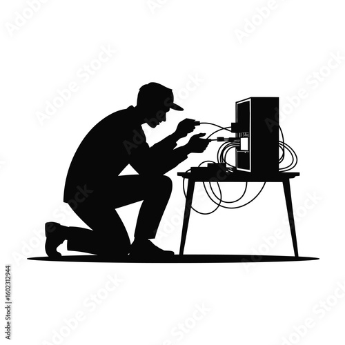 Silhouette of a technician working on computer equipment isolated on white background