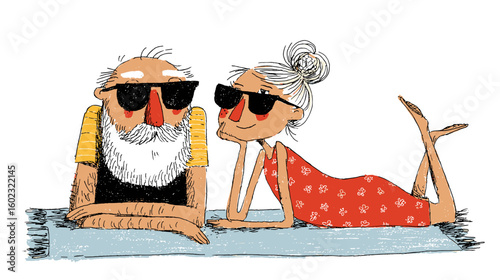 Fit elderly couple relaxing outdoors in sunglasses on beach towels  