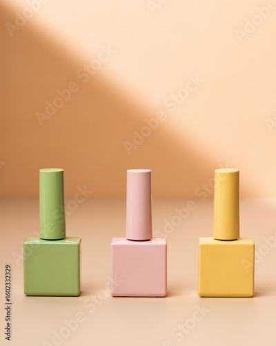 Green, butter yellow and pink varnish bottles for female manicure, beauty salon glamour, gel nail design. Background for glamour beauty salon