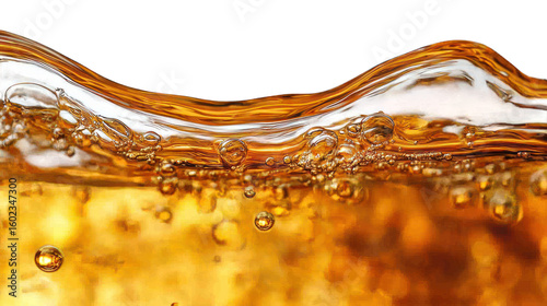 Sparkling amber liquid with bubbles against a black background