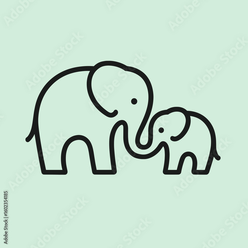 Adult and baby elephants touching trunks on pastel green background  