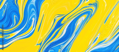 Abstract swirling paint design in blue and yellow