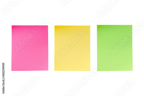 Colorful Sticky Notes: Three vibrant sticky notes, a trio of pink, yellow, and green, create a visually striking arrangement.