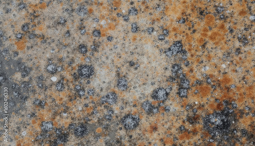 Granite surface with natural textures in gray and orange tones  