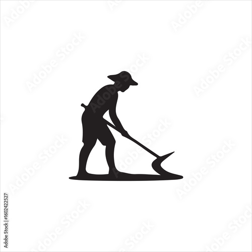 Silhouette of a person wearing a hat digging with a shovel gardening