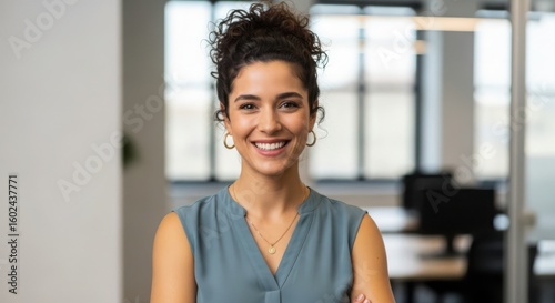 Woman with curly hair smiles and wears a blue sleeveless top and gold necklace female person Free Download Woman with curly hair smiles and wears a blue sleeveless top and gold necklace female person - GFXLoad