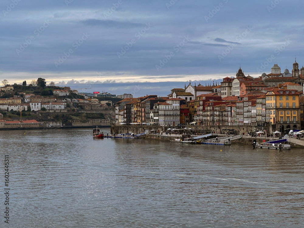 Fototapeta premium Romantic backstreet, side street or alley in historic old town of Porto Oporto, Portugal with colonial colorful tile style architecture facades, a landmark sightseeing tourist spot in old town
