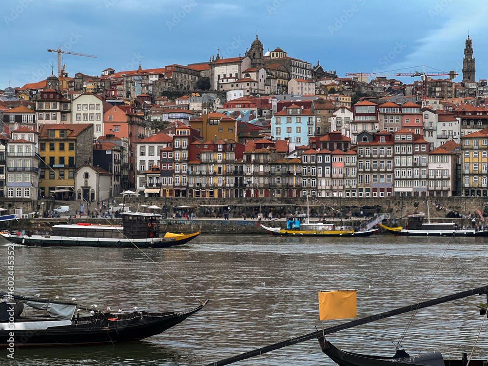 Fototapeta premium Romantic backstreet, side street or alley in historic old town of Porto Oporto, Portugal with colonial colorful tile style architecture facades, a landmark sightseeing tourist spot in old town