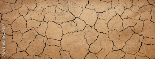 Cracked earth background with a dry, textured style. The background is brown, with brown tones and natural, rugged patterns. Dry cracked soil texture background. Brown background vector.