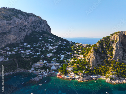 Fototapeta Naklejka Na Ścianę i Meble -  Capri. Amalfi coast. Italy. Drone view. View from above. Buildings and landmarks of Capri. Drone view of Capri. Boats and yachts. The most famous island.