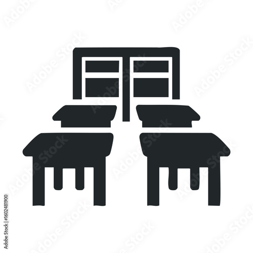 Classroom icon with desks and chalkboard in black and white silhouette style