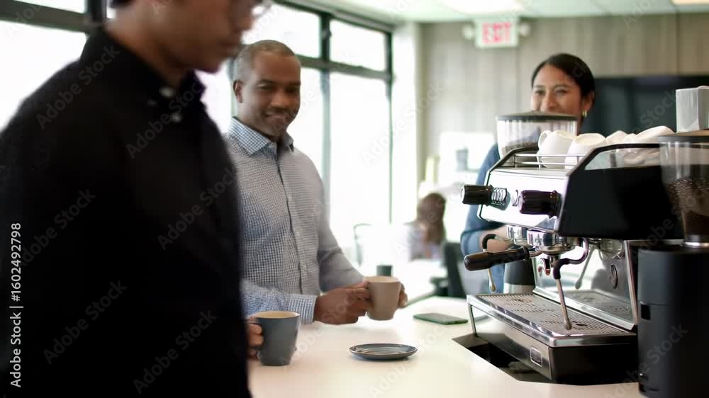Colleagues enjoying coffee at a modern office cafe Colleagues enjoying coffee at a modern office cafe