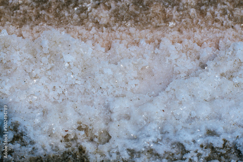 Pyramids of sea salt ready to be harvested in a salt farm at sunrise. Used as a seasoning in food, cosmetics and for food preservation.
