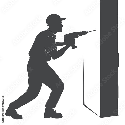 Silhouette of Construction Worker Using Electric Drill on Wall
