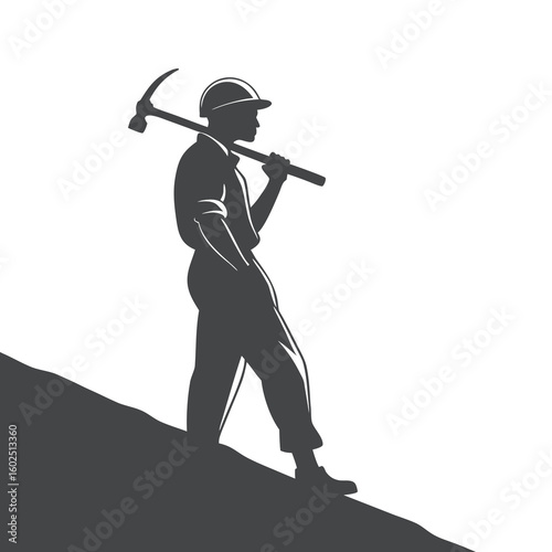 Silhouette of Construction Worker Holding Pickaxe on Incline
