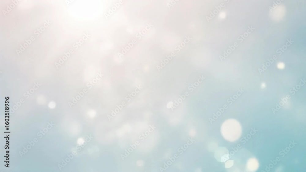 Abstract background of shimmering bokeh particles and soft glowing lens flare against a gentle blue gradient. Abstract background of shimmering bokeh particles and soft glowing lens flare against a gentle blue gradient.