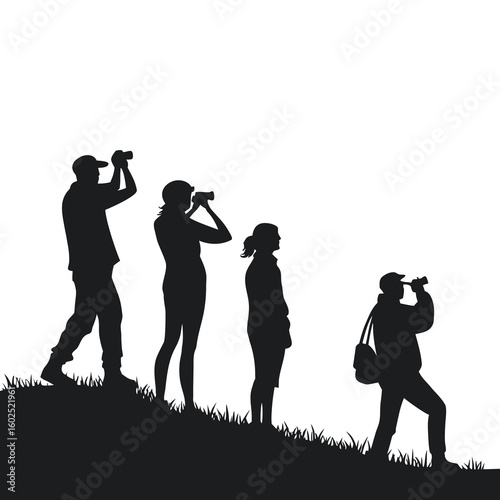 Silhouette of Group Birdwatching on Hillside with Binoculars
