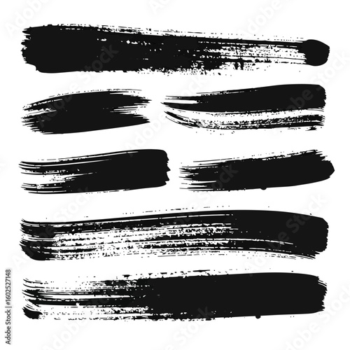 Set of seven black grunge brush strokes with textured, distressed edges and dry bristle marks.