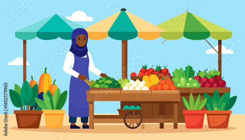 A Black woman in a blue hijab and apron selling fresh produce at an outdoor market stall.