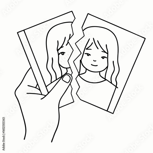 Reflection on loss: girl holding torn drawing in black and white