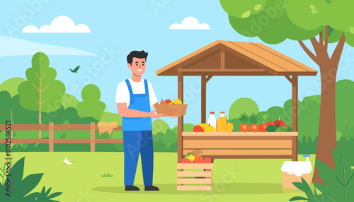 Happy young farmer in blue overalls holding a basket of fresh fruit at his outdoor market stall.