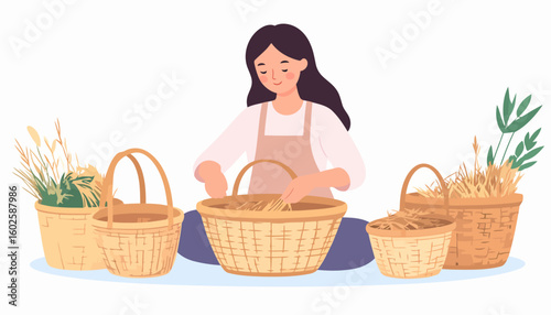 A calm woman in an apron sitting and arranging dried plants and straw in handmade wicker baskets.