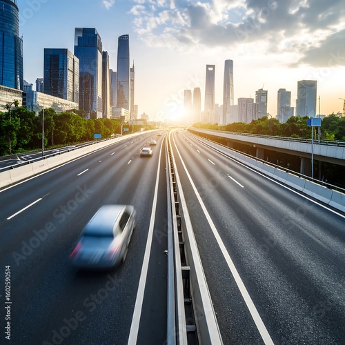 Expressway through cityscape at sunset