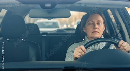 Lack of Concentration Evident in Unfocused Stare While Car Idles Through Morning Congestion