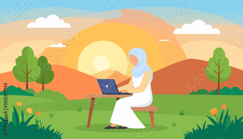 A woman in a pale blue hijab and white dress, seated at a wooden table, focused on her dark blue laptop.