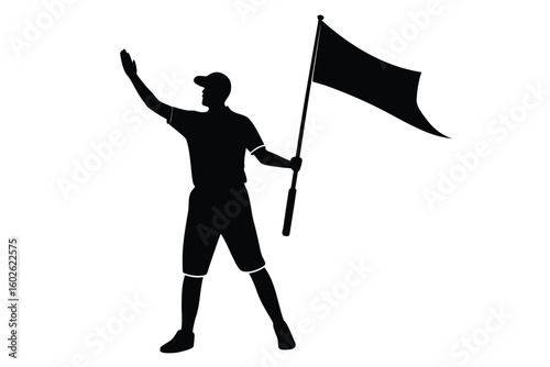 Silhouette of a person holding a flag and waving