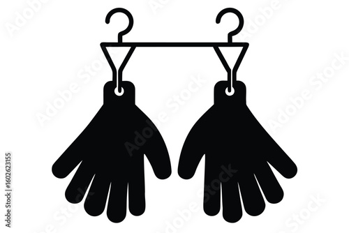 Black silhouette of gloves hanging on a clothes hanger