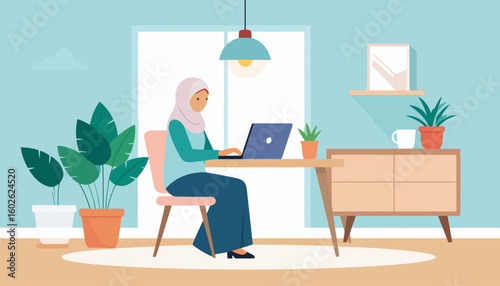 Focused Muslim woman in a light purple hijab working on a blue laptop at a wooden desk.