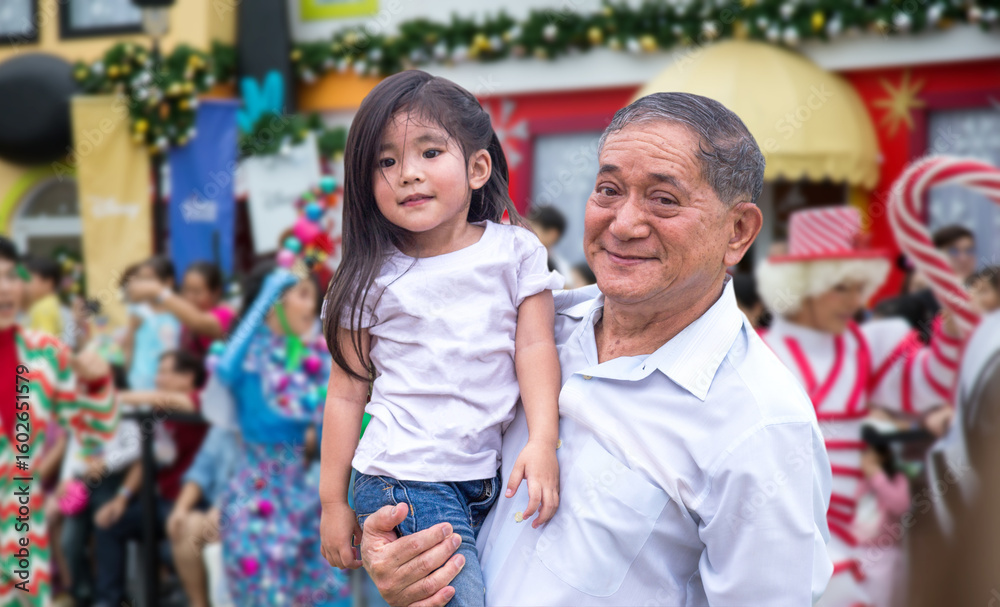 Obraz premium Generations unite at a lively parade, sharing new experiences and creating unforgettable family moments