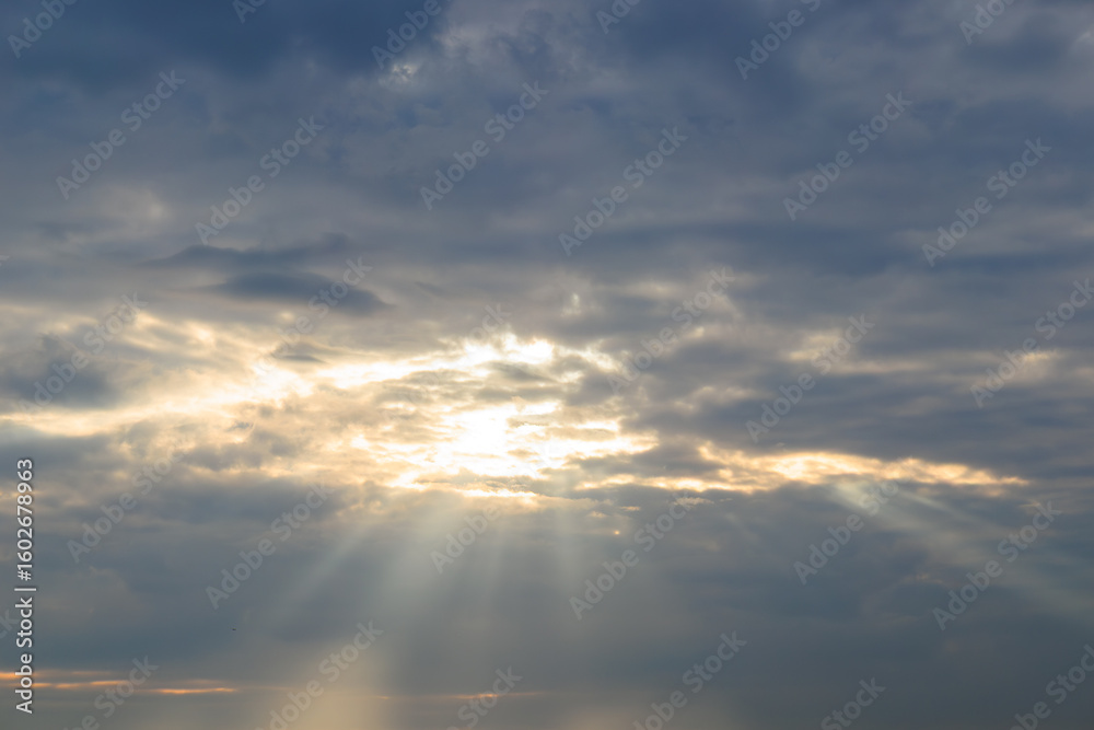 Fototapeta premium sunset sky with clouds and sunbeams, can be used as background