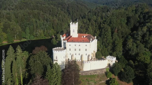 Majestic castle and lake Trakoscan in Zagorje, Croatia, aerial panoramic view.
