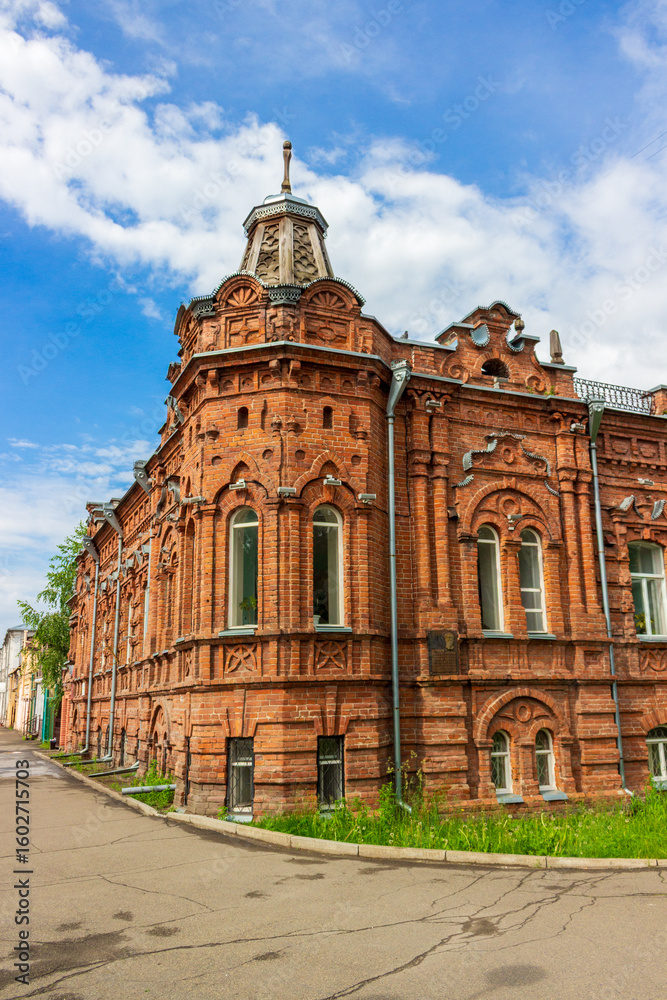 Fototapeta premium Historic building of House of merchant A.D. Vasenev in Biysk, Russia. Brick mansion built in 1904. Building is a monument of architecture and cultural history