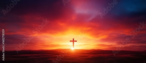 A radiant sunrise illuminates a solitary cross on a hill against a vibrant sky of fiery oranges, reds, and deep purples.