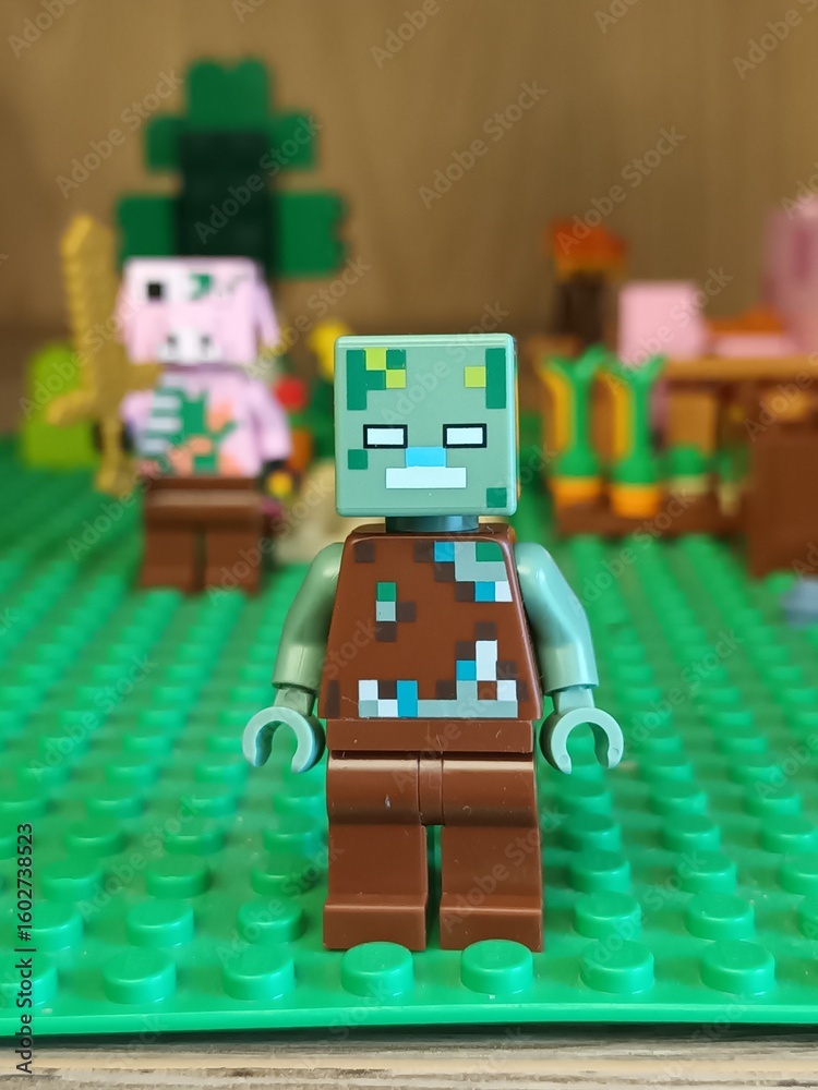 Fototapeta premium Minecraft Lego Zombie Minifigure on Green Baseplate