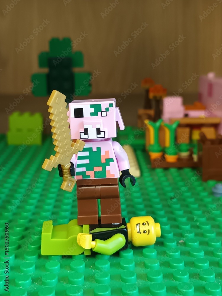 Fototapeta premium Minecraft Lego Piglin Barbarian Standing Over Fallen Minifigure