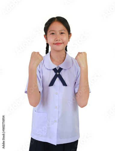 Portrait of smiling Asian student girl in school uniform raised hands fist for fight sign or winner isolated on white studio background.