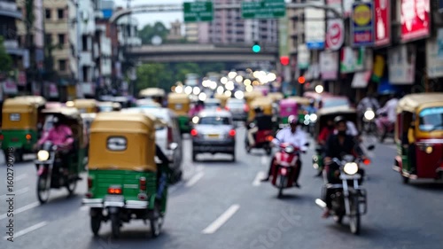 Wallpaper Mural Many people riding on a busy city street. Traffic in a city with vehicles busy. Urban transportation with street movement in the city. Numerous individuals traveling along a crowded urban lifestyle. Torontodigital.ca