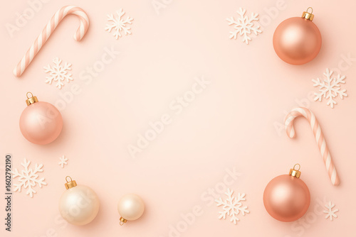 A festive arrangement of pink and white Christmas ornaments, candy canes, and snowflakes on a soft pink background. Perfect for holiday decorations.