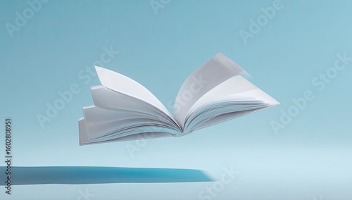 Open book levitating against light blue backdrop