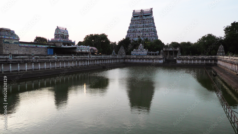 The large temple pond, a gateway tower and surroundings at Nataraja Temple, Chidambaram, Tamil Nadu, India The large temple pond, a gateway tower and surroundings at Nataraja Temple, Chidambaram, Tamil Nadu, India