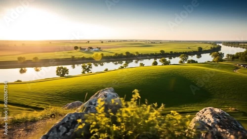 Sunrise Over Rolling Green Hills and River