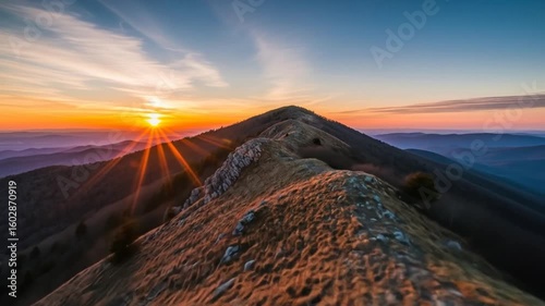 Sunrise over scenic mountain ridge at dawn