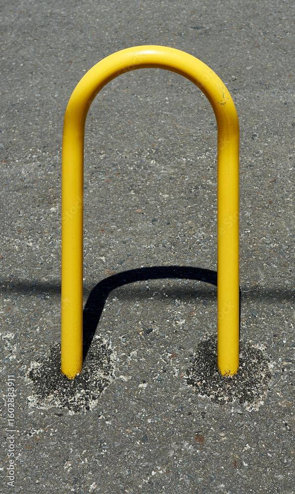 yellow-painted curved steel tube for securing bicycles yellow-painted curved steel tube for securing bicycles