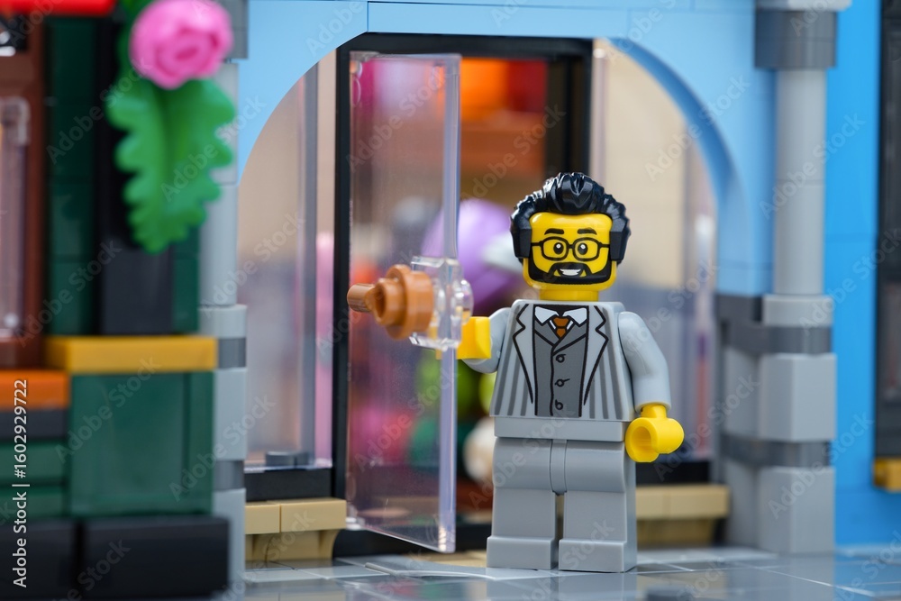 Obraz premium Tambov, Russian Federation - June 28, 2025 Lego seller man minifigure standing near the entrance of shop