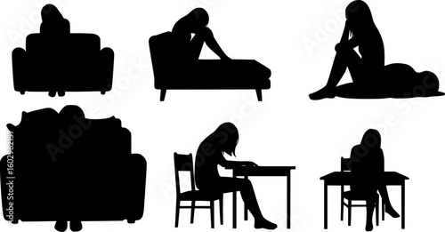 Silhouette of a frustrated woman sitting at home in the dark suffering from depression
